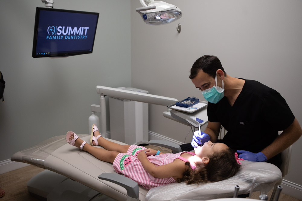 Image of Dr. Andy Pernell performing a pediatric dental checkup at Summit Family Dentistry in Denver, North Carolina