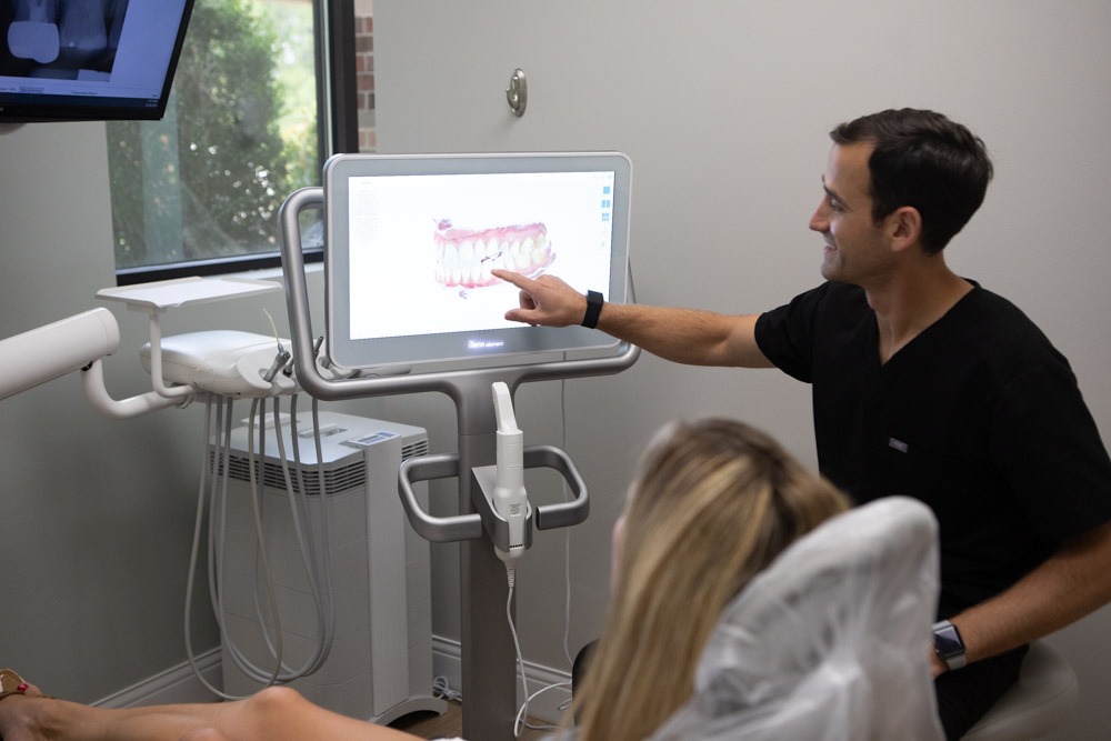 Image of Dr. Andy Pernell reviewing dental images with a patient at Summit Family Dentistry in Denver, North Carolina