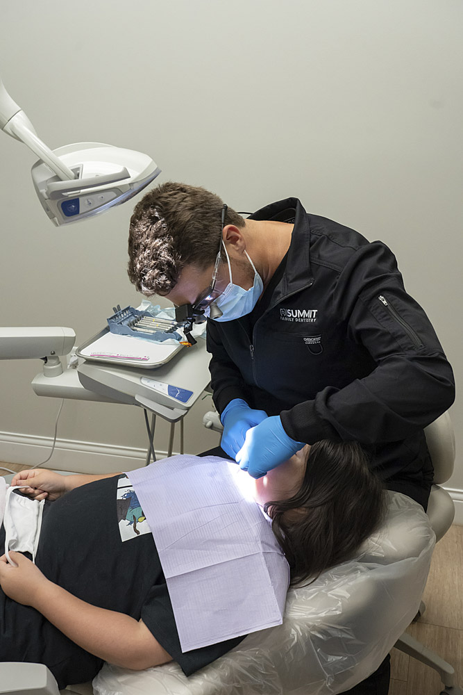 dr layne veneri performing dental work on a patient